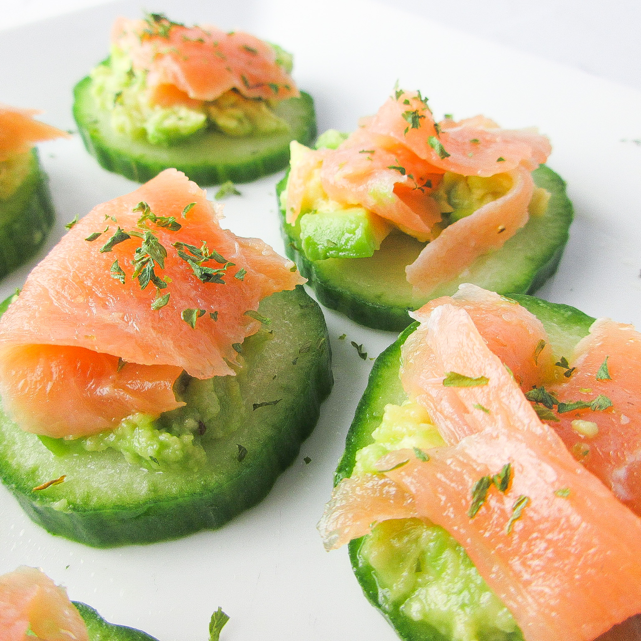 smoked salmon and cucumber slices on plate