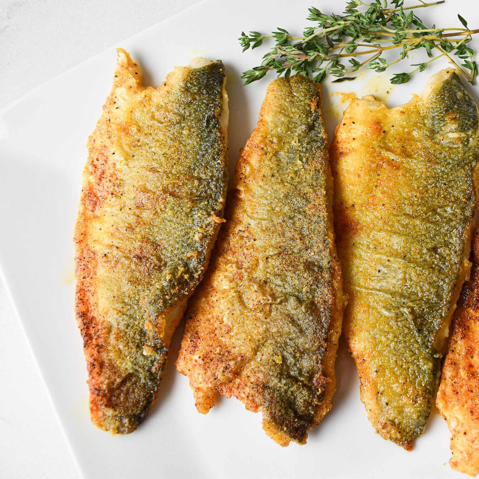 Lightly Dusted Pan-Fried Sea Bass Fillets - Andrea's Dainty Kitchen