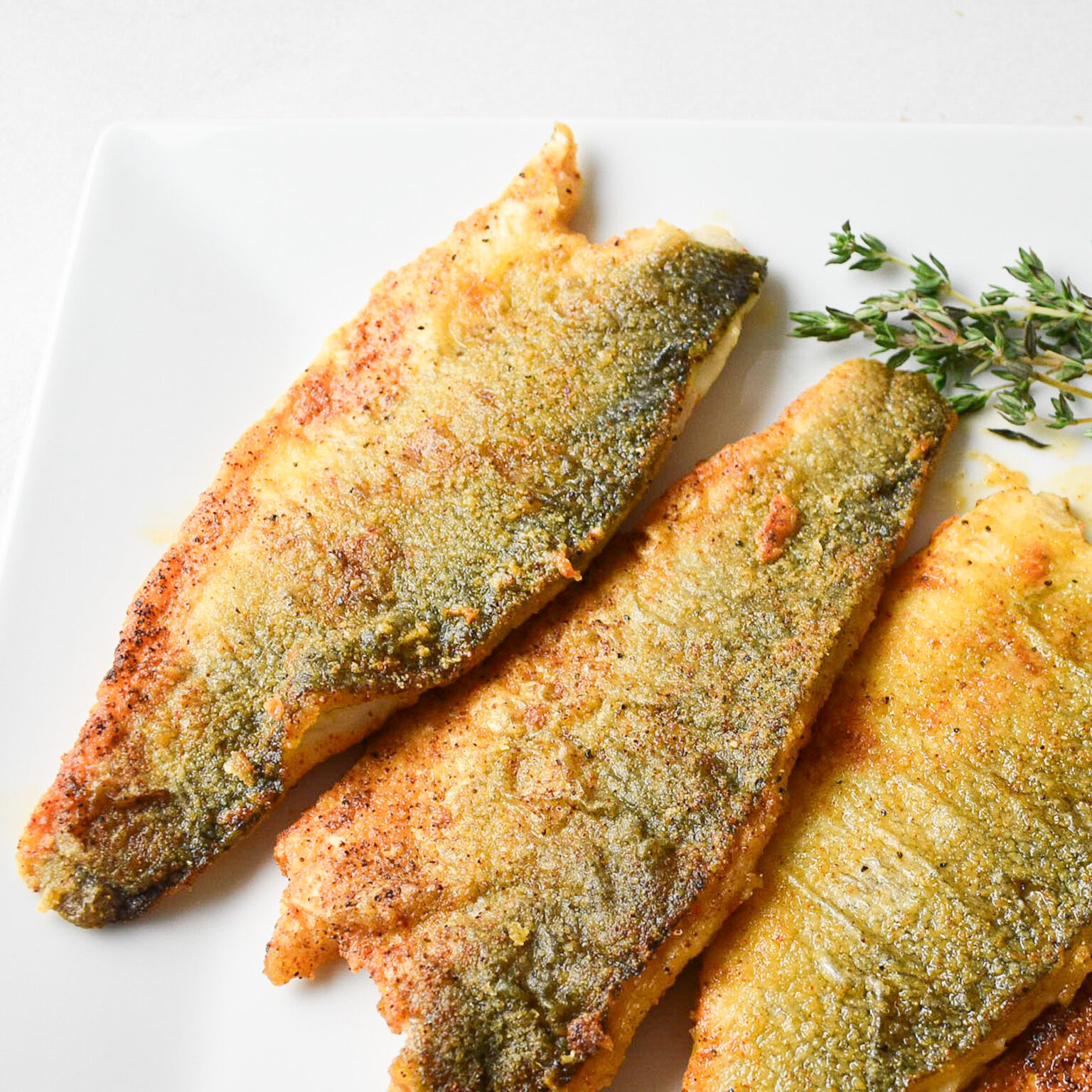 Lightly Dusted Pan-Fried Sea Bass Fillets - Andrea's Dainty Kitchen