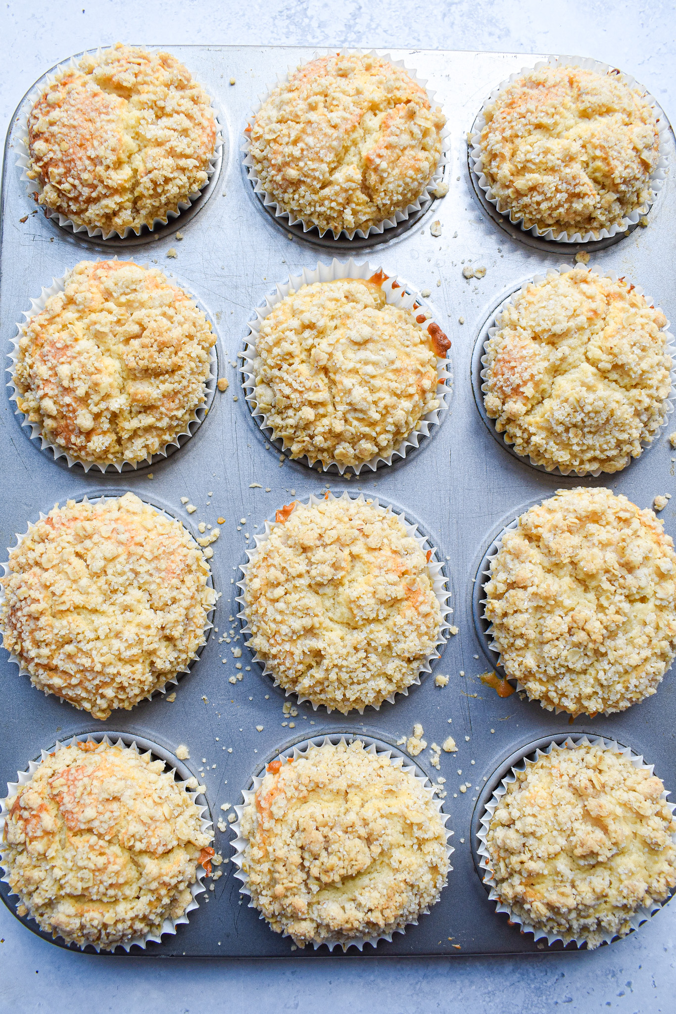 pear crumble muffins in baking tin