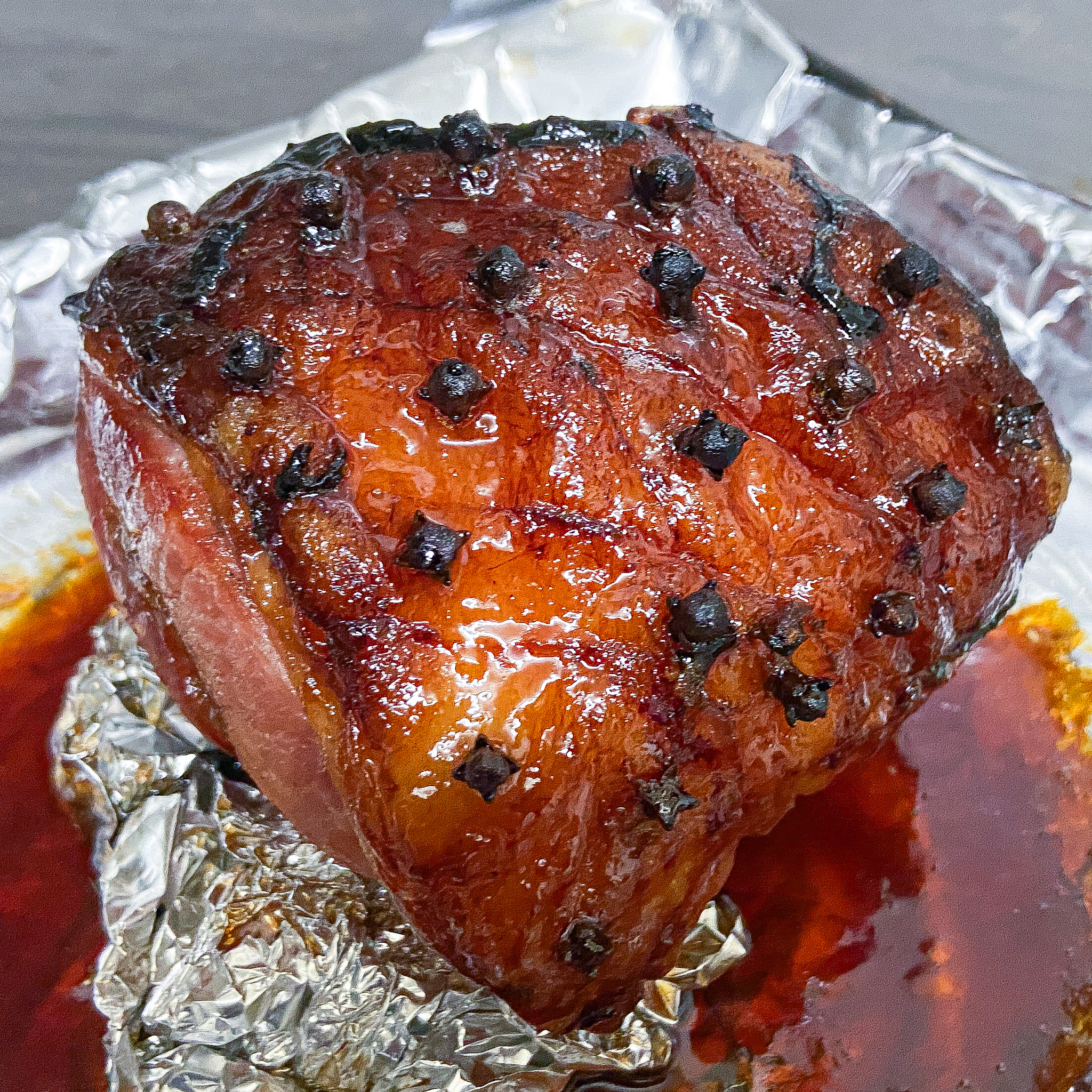 Honey Glazed Ham in roasting tin.