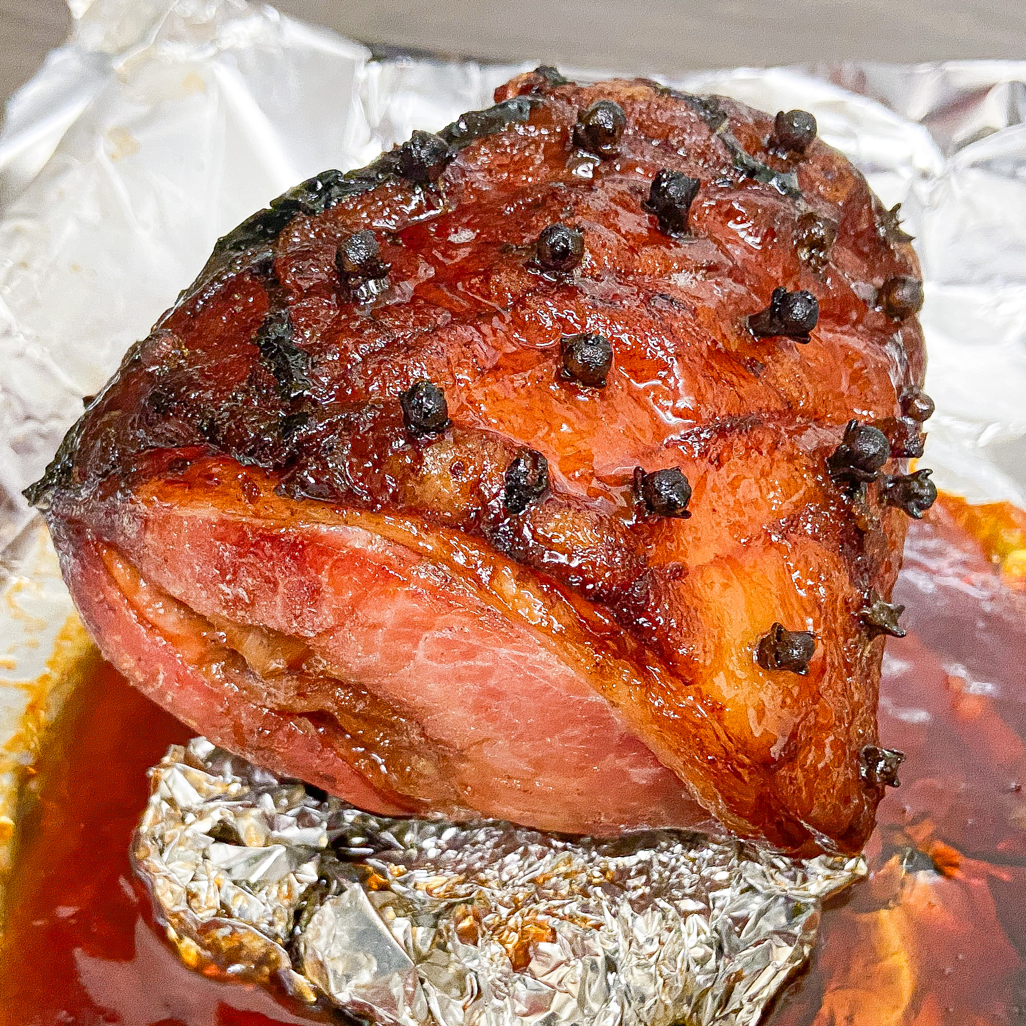 Honey Glazed Ham in roasting tin.